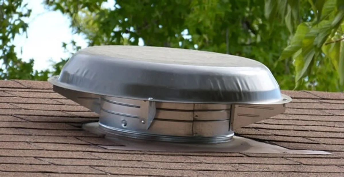 attic fan installation services with low-profile roof ventilation unit in Aurora, CO