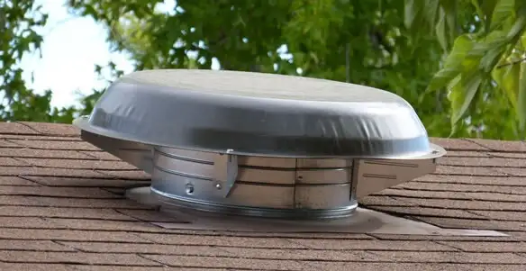attic fan installation services with low-profile roof ventilation unit in Aurora, CO