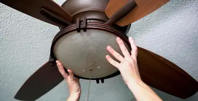 Ceiling fan repair and reinstallation on ceiling mount in Aurora, CO