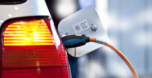 Electric car plugged into EV charger after professional installation in Aurora, CO