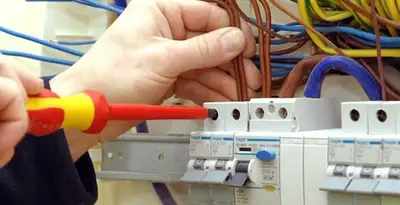 electrician services performing professional electrical panel wiring and connections in Aurora, CO