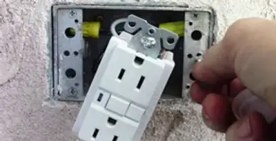 gfci circuits service showing installation of a ground fault circuit interrupter outlet by licensed electricians in Aurora, CO