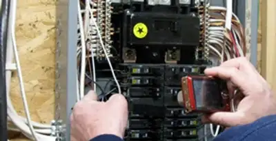 Home electrical inspection of circuit breaker panel by licensed electrician in Aurora, CO