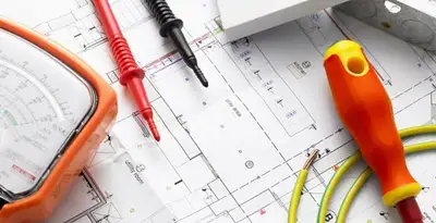 licensed electrician planning and testing electrical systems using professional tools in Aurora, CO