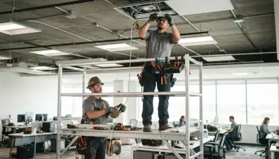 Aurora, CO electrician installing residential lighting fixtures and wiring for a home remodel