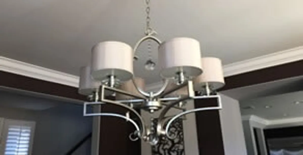 Modern chandelier installation with multiple light fixtures in Aurora, CO