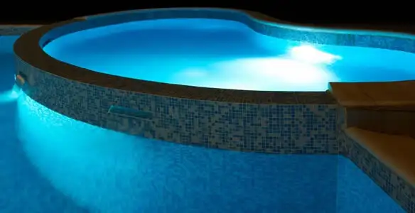 pool light installation and repair services highlighting illuminated pool interior lighting in Aurora, CO