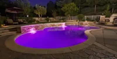 pool light installation and repair services illuminating a residential swimming pool in Aurora, CO