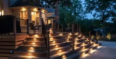 Residential electrician installing outdoor lighting for home safety in Aurora, CO