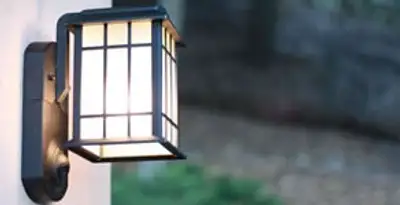 security light installation services with professionally mounted exterior wall light in Aurora, CO