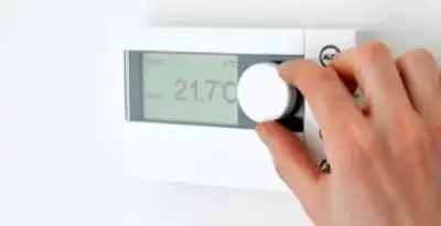 Thermostat installation service with professional adjusting temperature control in Aurora, CO